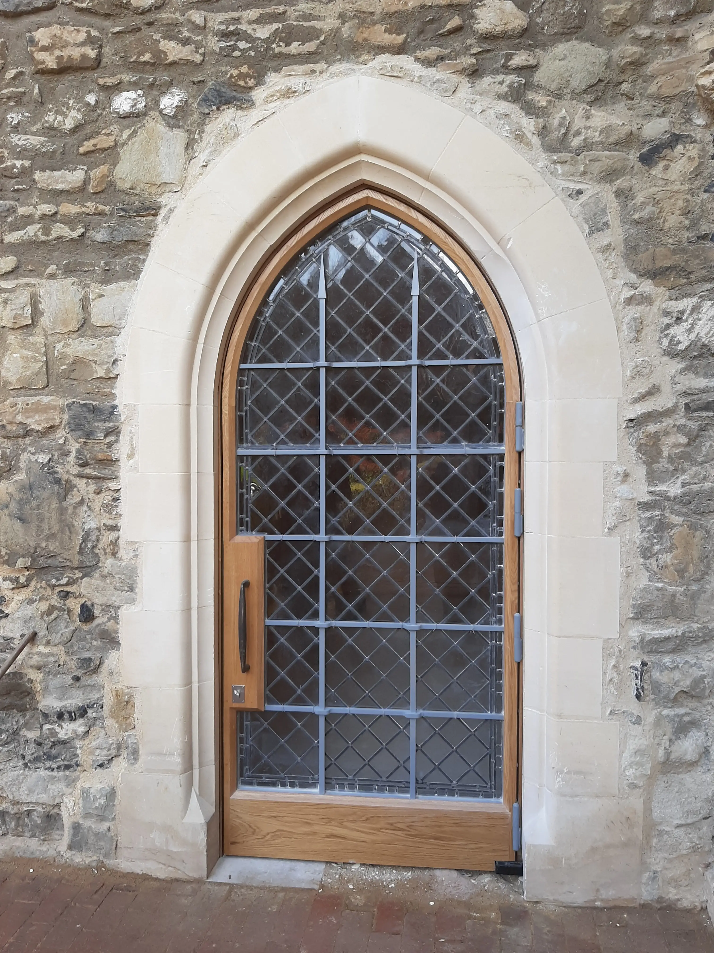 Reproduction Gothic-style leaded window in oak frame with lead came holding small glass panes