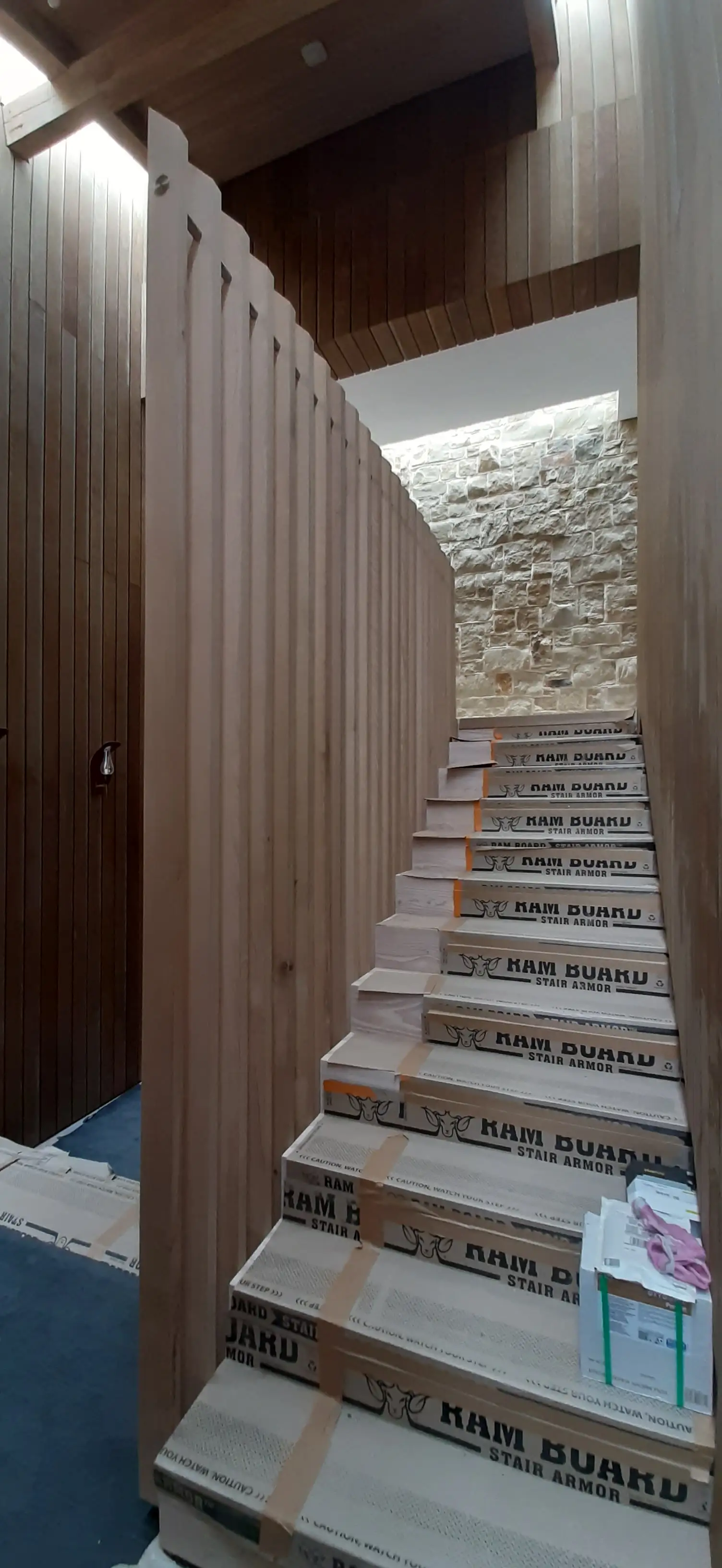 Period staircase mid-restoration with structural repairs in progress