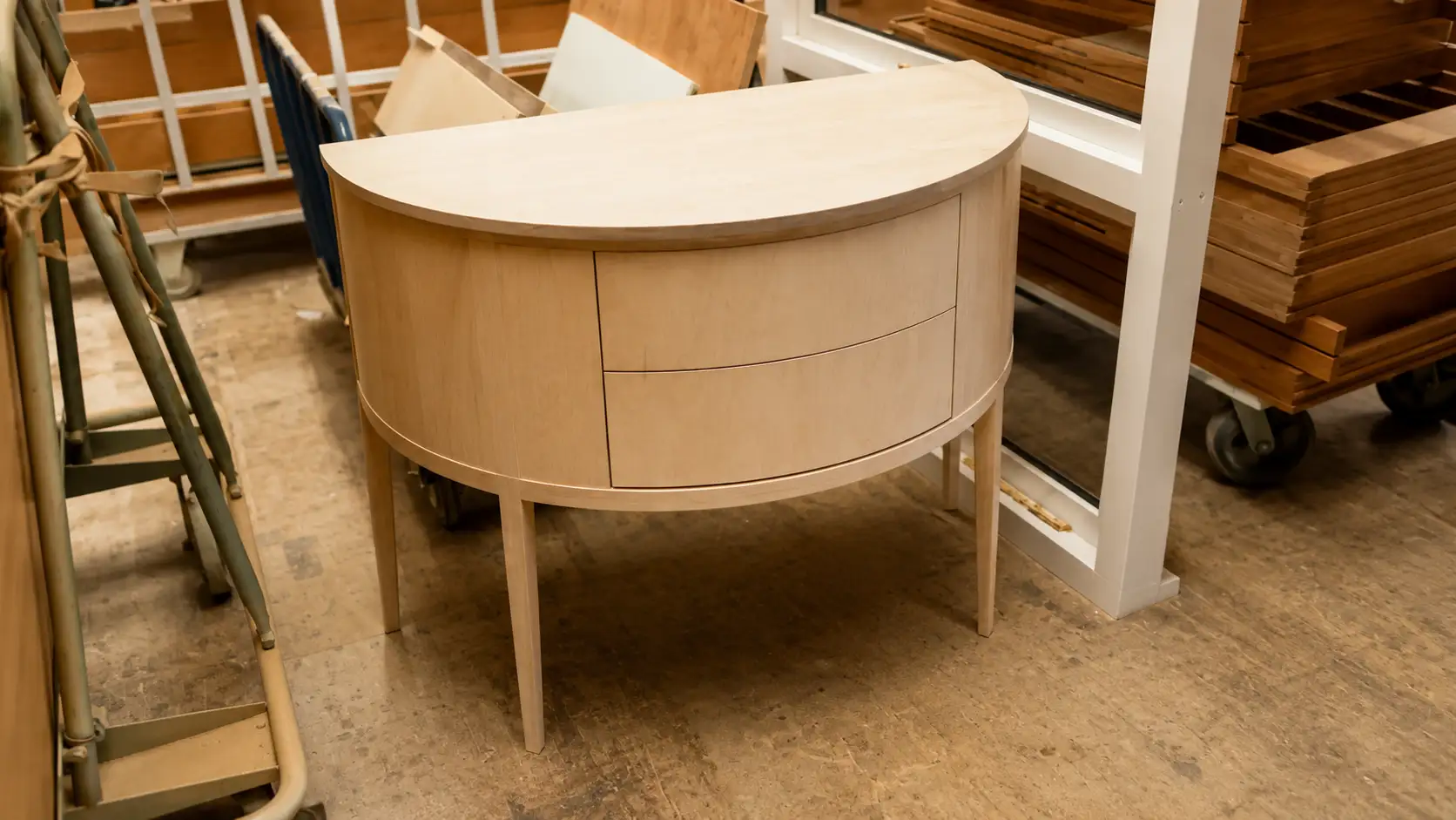 Half-moon bow-fronted bedside cabinet in oak, under construction in the Forest Joinery workshop
