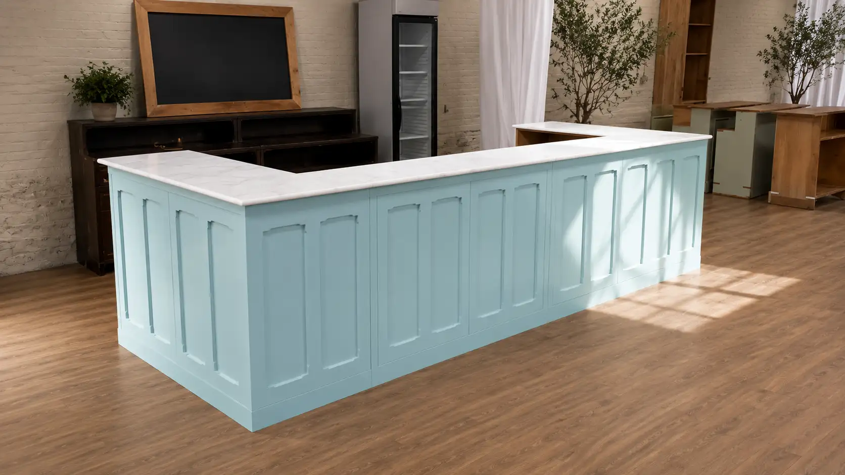 Bespoke pale-blue panelled counter with a marble top in a commercial fit-out